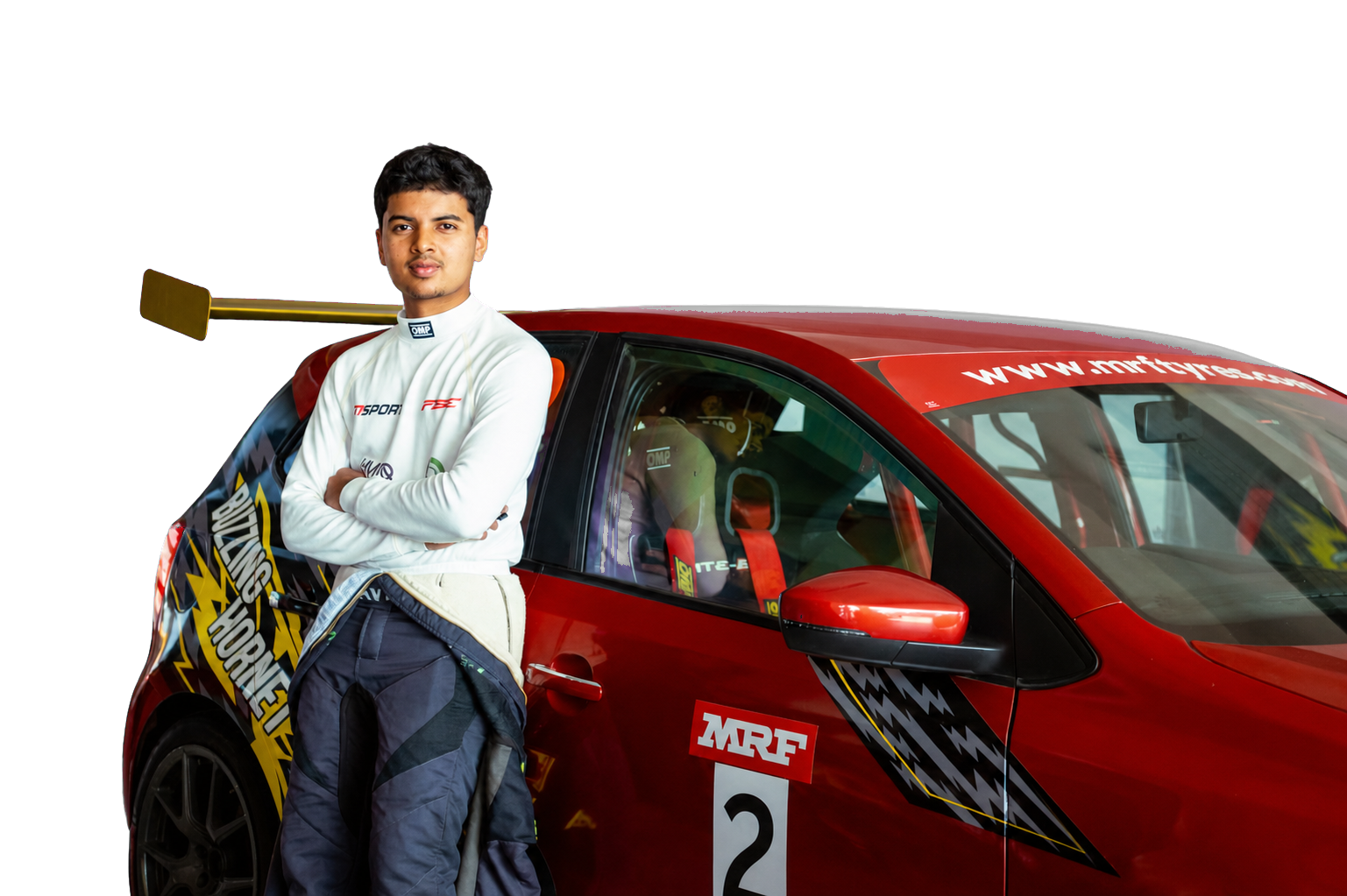 Avi Malavalli standing beside his red race car
